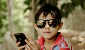 child holding a smartphone